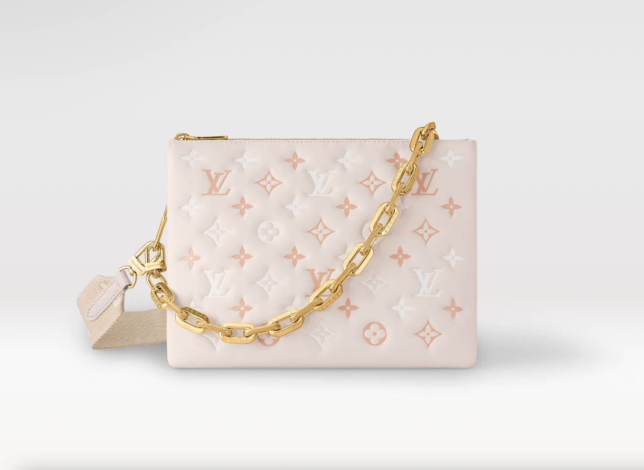 Cream Louis Vuitton monogram clutch bag with gold chain strap and embossed design