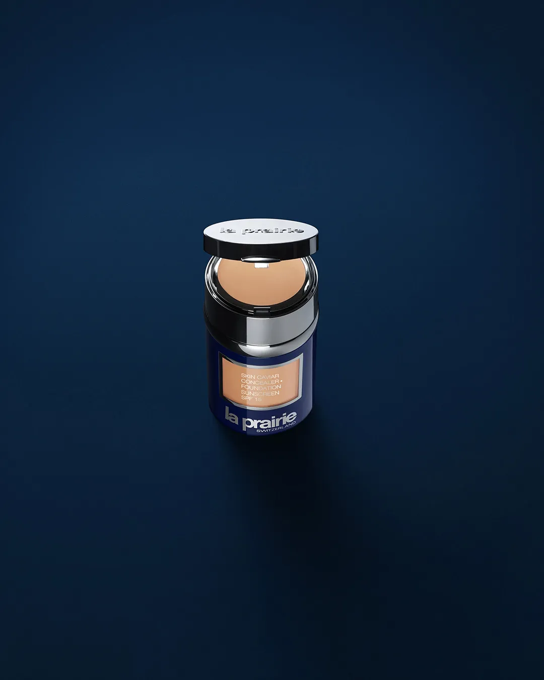 La Prairie Skin Caviar concealer foundation compact on dark blue background
