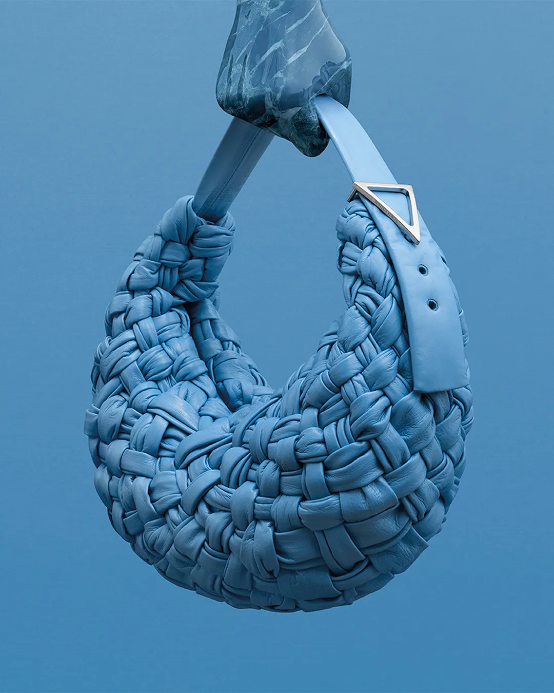 Blue Bottega Veneta woven leather handbag with sculptural handle detail