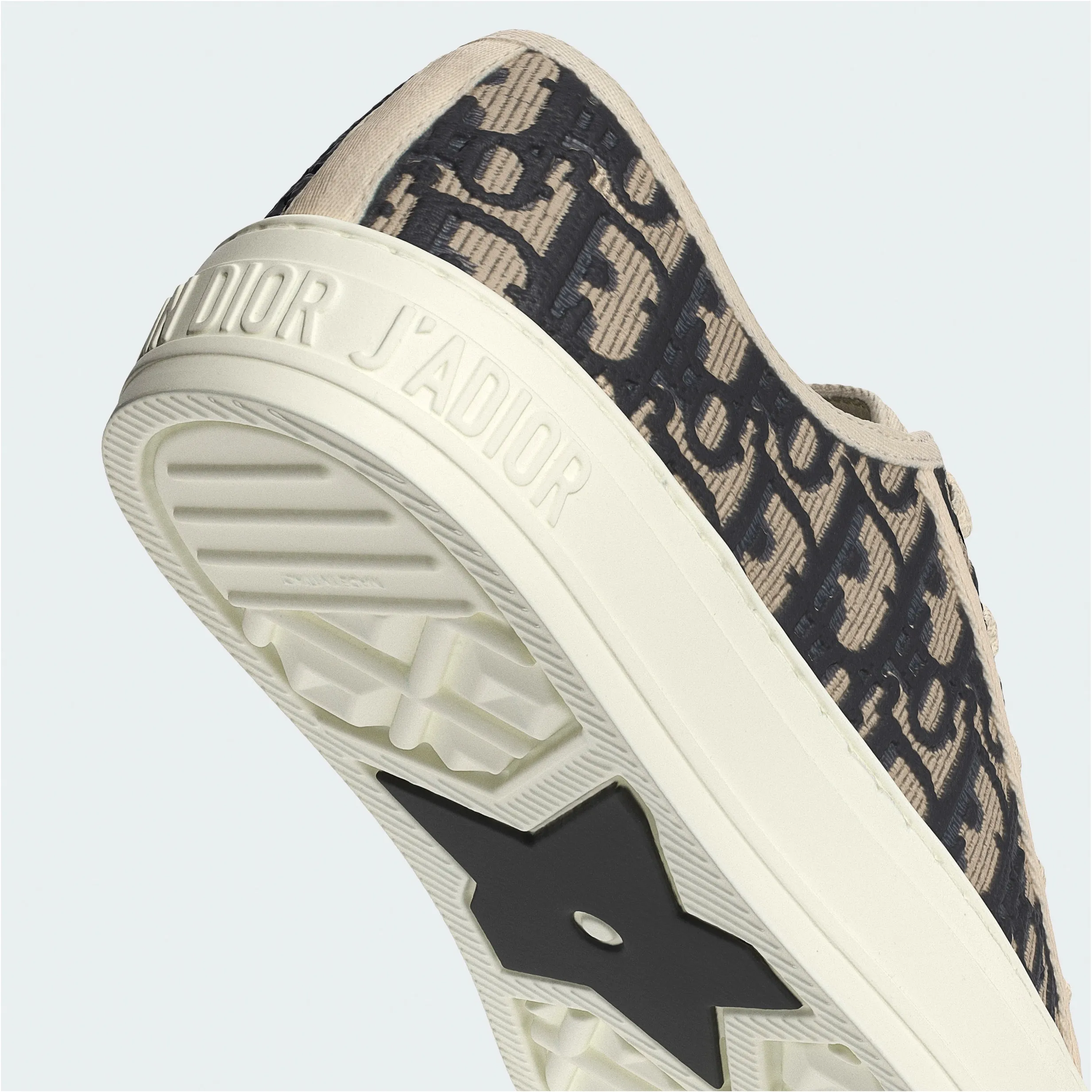 Close-up of Dior J’Adior sneaker with Oblique monogram canvas and textured sole detail displayed in portfolio image