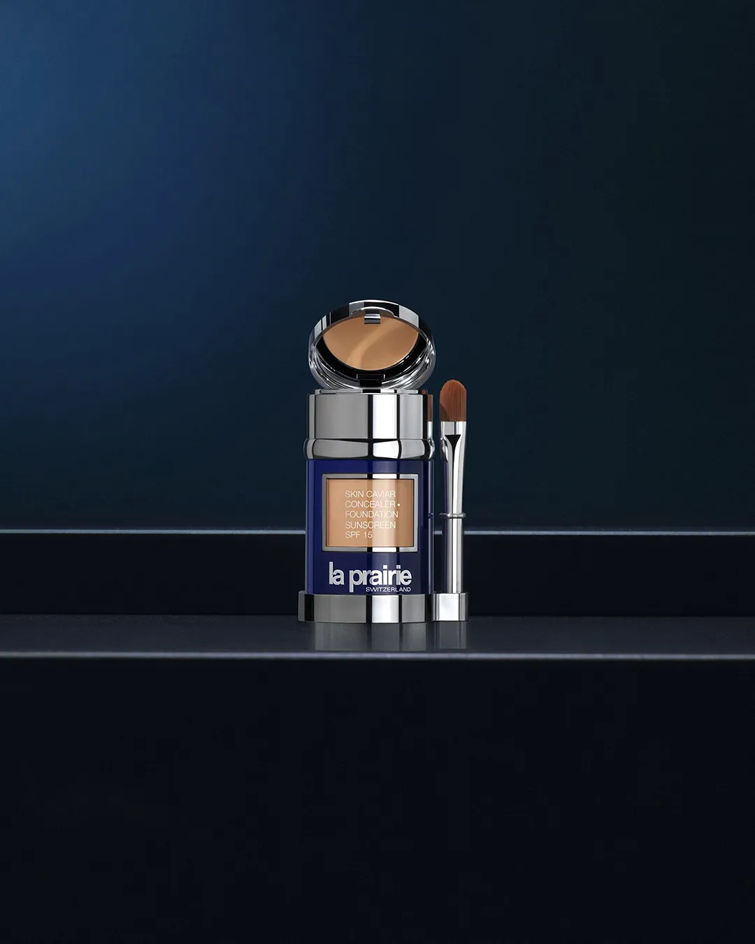 La Prairie Skin Caviar concealer foundation with brush on dark background
