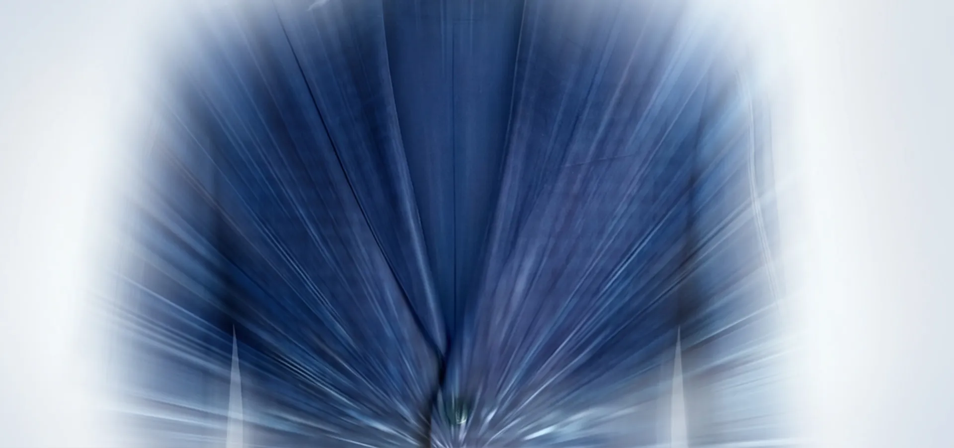Luxury fabric texture with dynamic motion blur effect representing premium fashion craftsmanship and brand elegance